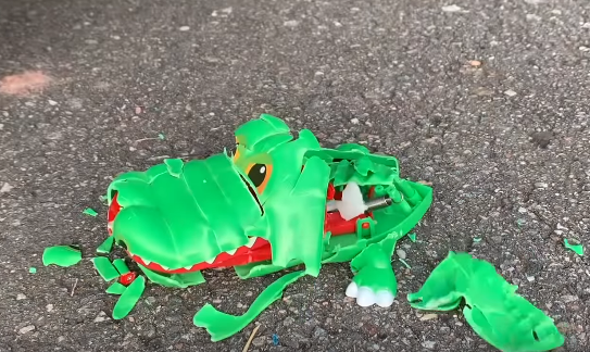 the car under the wheels crushed this crocodile toy smelly